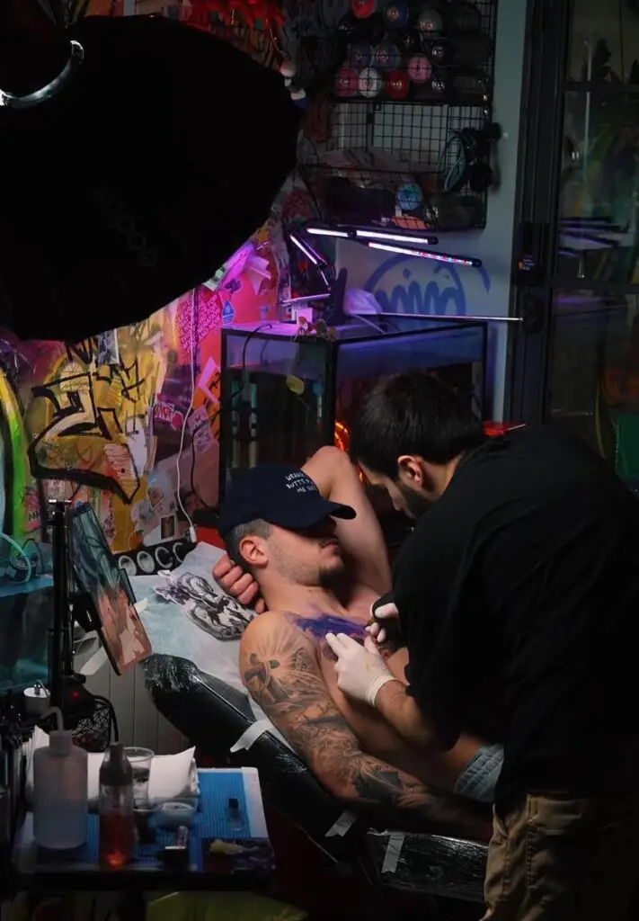 Professional tattoo artist creating a custom design at Zona Tattoo Studio in Tbilisi